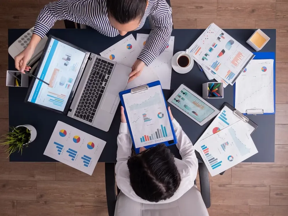 Agency team reviewing SEO performance charts on a laptop